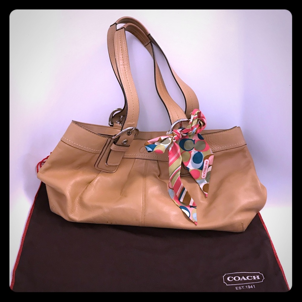 Coach purse. Comes with storage bag and ribbon.